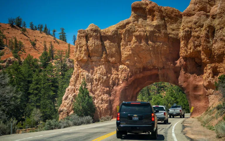 Cars pass through Red Canyon in Dixie National Forest. 