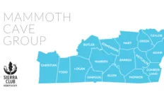 Upper left corner has thin black text reading Mammoth Cave Group.  Lower left corner has a black Sierra Club Kentucky logo.  The right side of the image is a bright blue map showing all the counties that make up the Mammoth Cave Group. 
