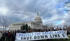 protesters of Line 5 holding banner in front of White House