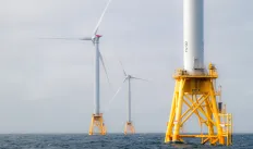 image of offshore wind turbines in the ocean.