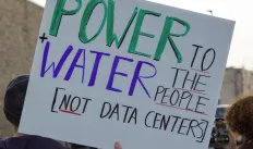 protest sign that says Power plus water to the people, not data centers