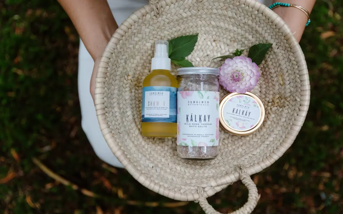 A pair of hands cradles a basket of gifts