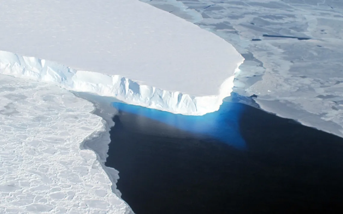 The calving front of Thwaites Ice Shelf looking at the ice below the water’s surface as seen from the NASA DC - 8 on October 16, 2012. Photo by James Yungel | NASA IceBridge
