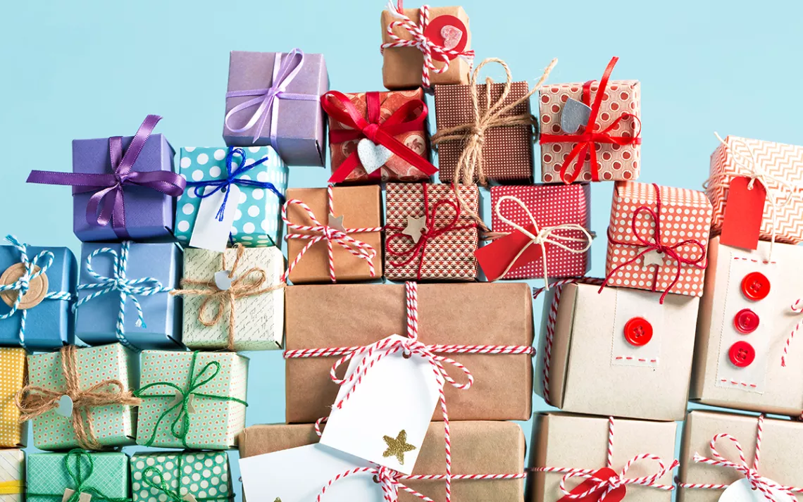 A pile of gift-wrapped boxes tied up with bows