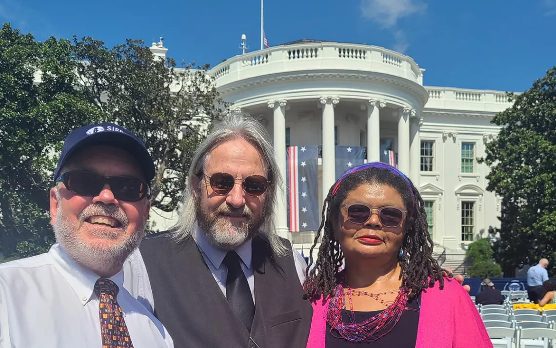 Sierra Club staff and board members celebrate the Inflation Reduction Act at the White House. 