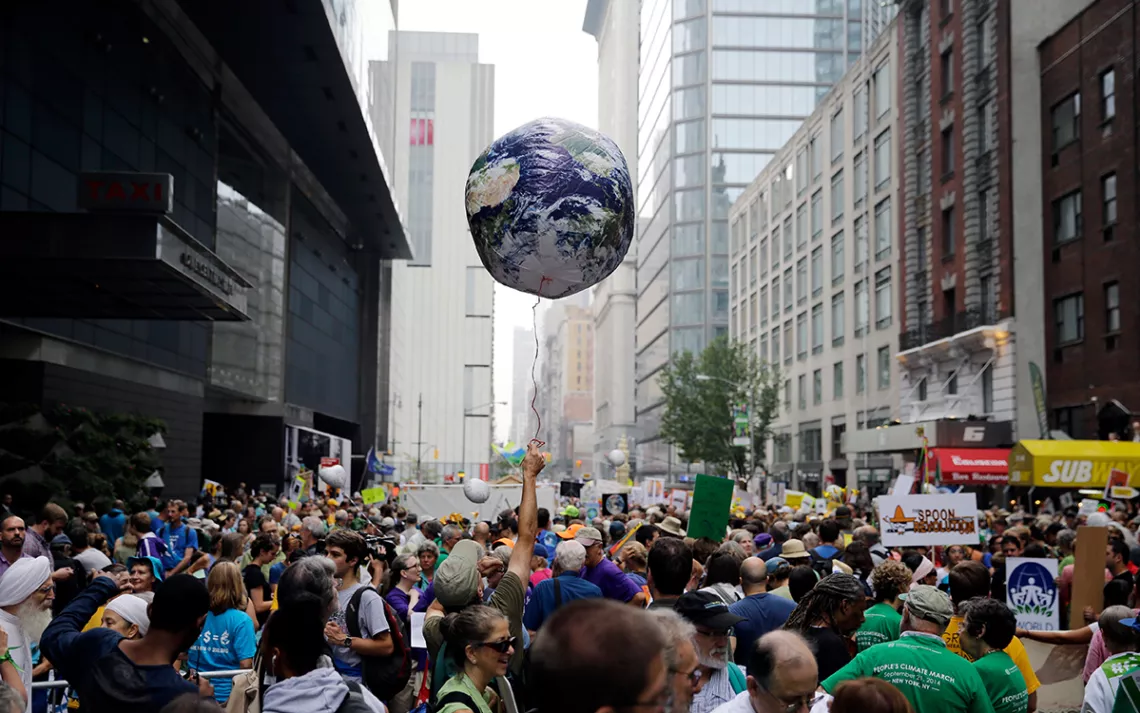 Balloon in air with crush of demonstrators