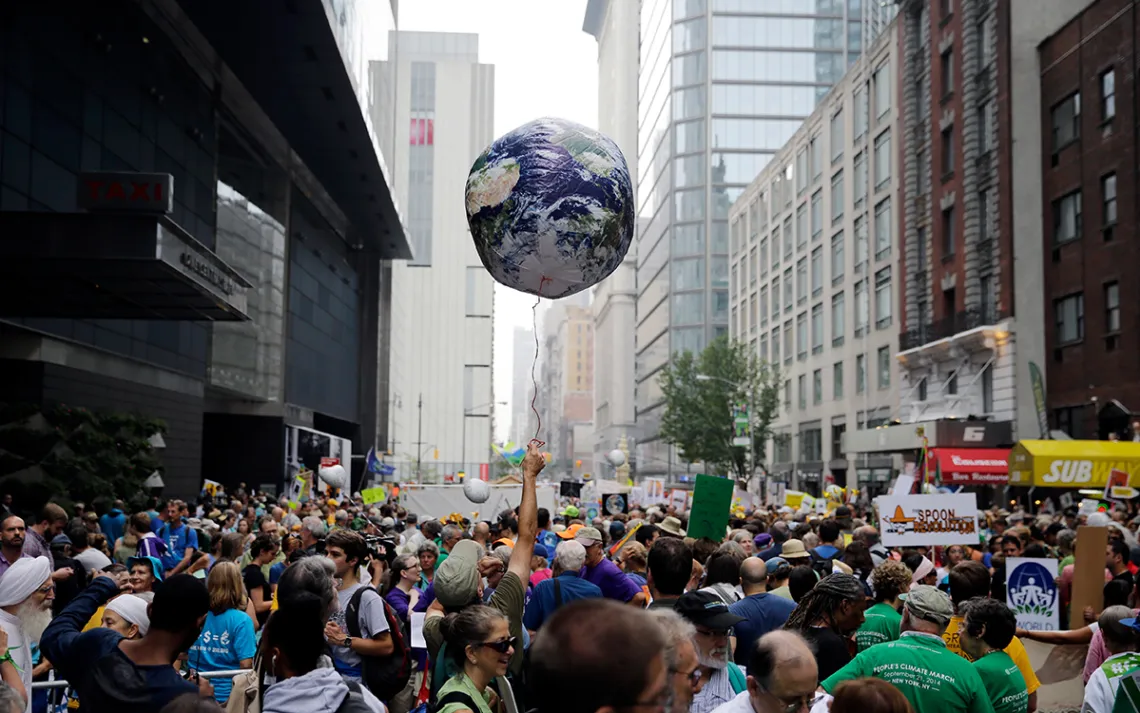 Balloon in air with crush of demonstrators