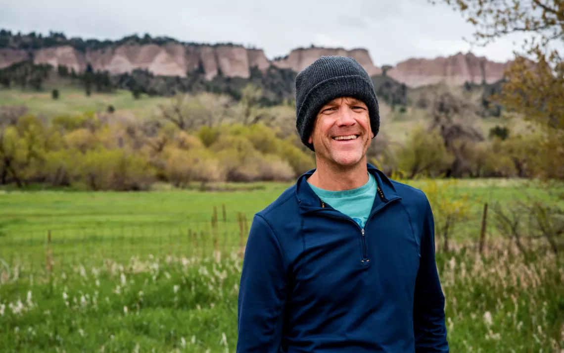 Steve Myers wears a knit cap and smiles at the camera.