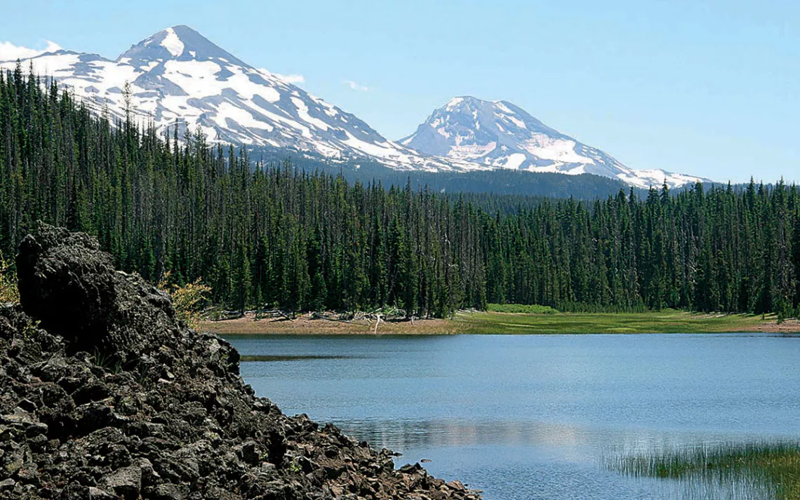 Hand Lake with the Three Sisters volcanic peaks in the background in Oregon's Willamette National Forest.