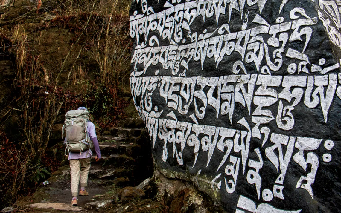 In the Nepalese Himalayas, many trails are flanked by mani, stones inscribed with Buddhist prayers. 