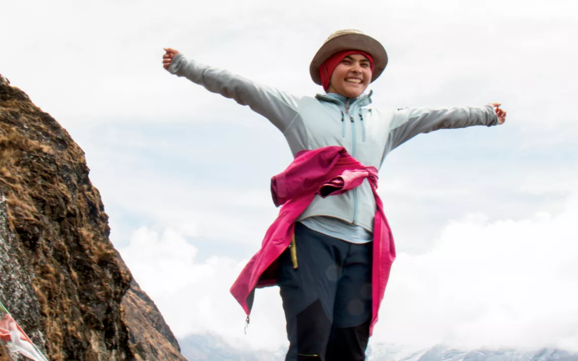 Eighteen-year-old Neki Haidari celebrates after climbing a mountain above the village of Phortse. "All people like climbing in the mountains," she says. 