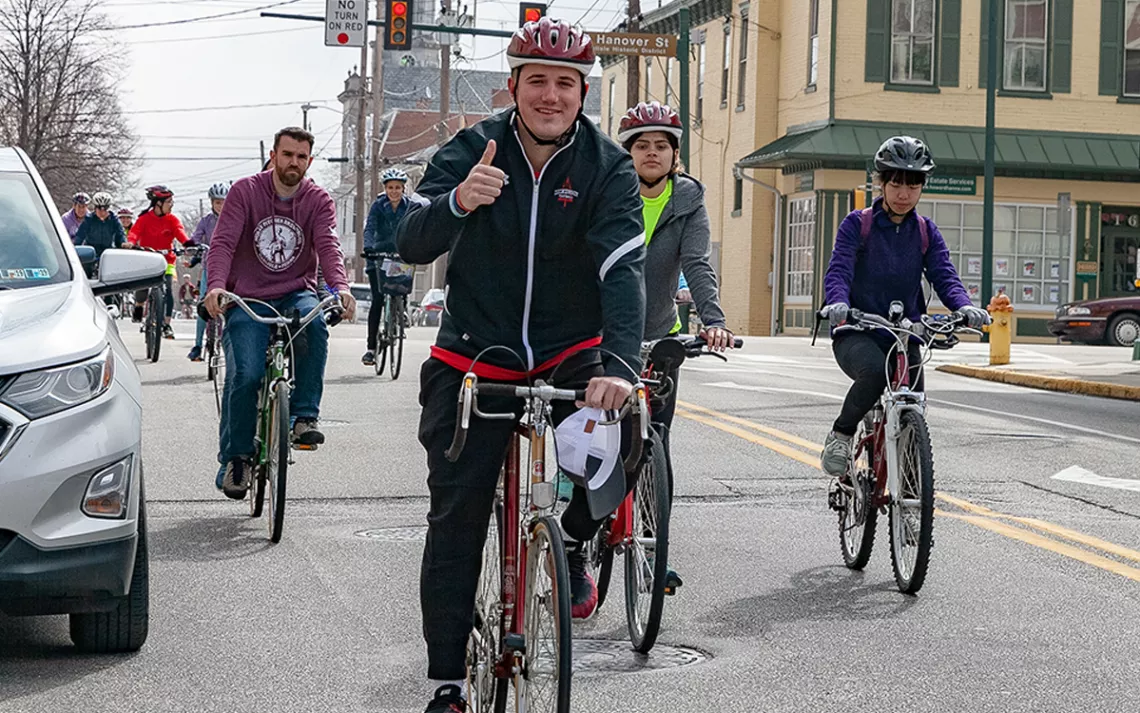 Dickinson College students and local residents ride together to promote bike safety.
