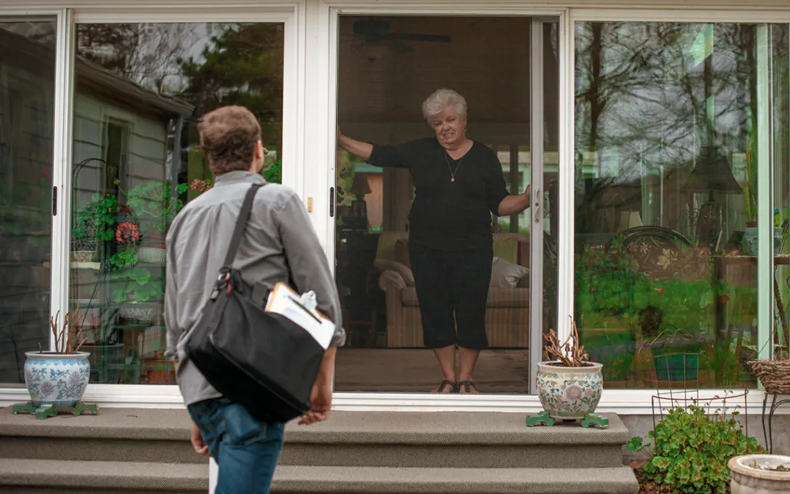 Judy Wanchisn greets Chad Nicholson of the Community Environmental Legal Defense Fund.