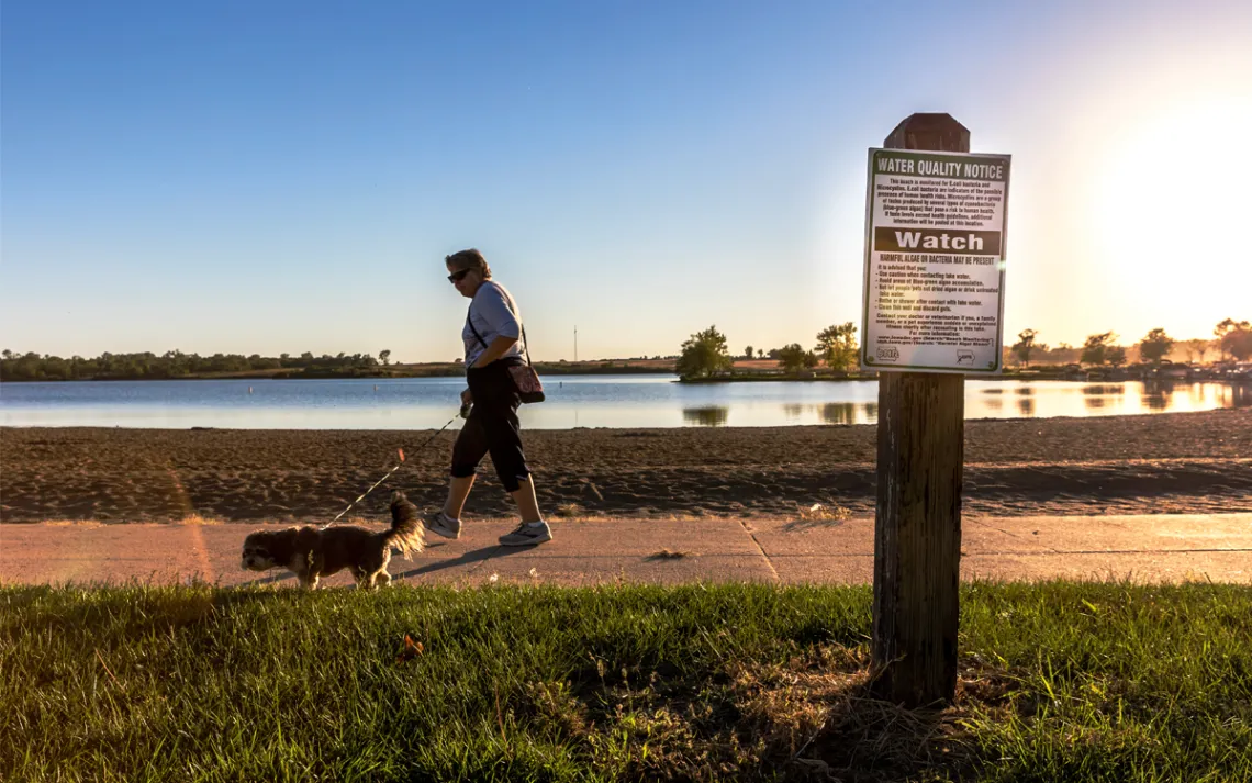 A sign warns of poor water quality at Big Creek State Park in Polk City.