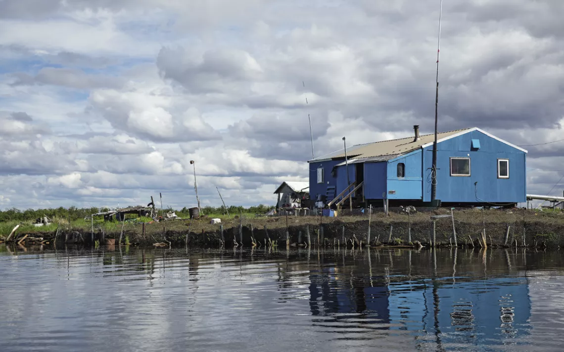 Home near a continually eroding section of the Selawik River.