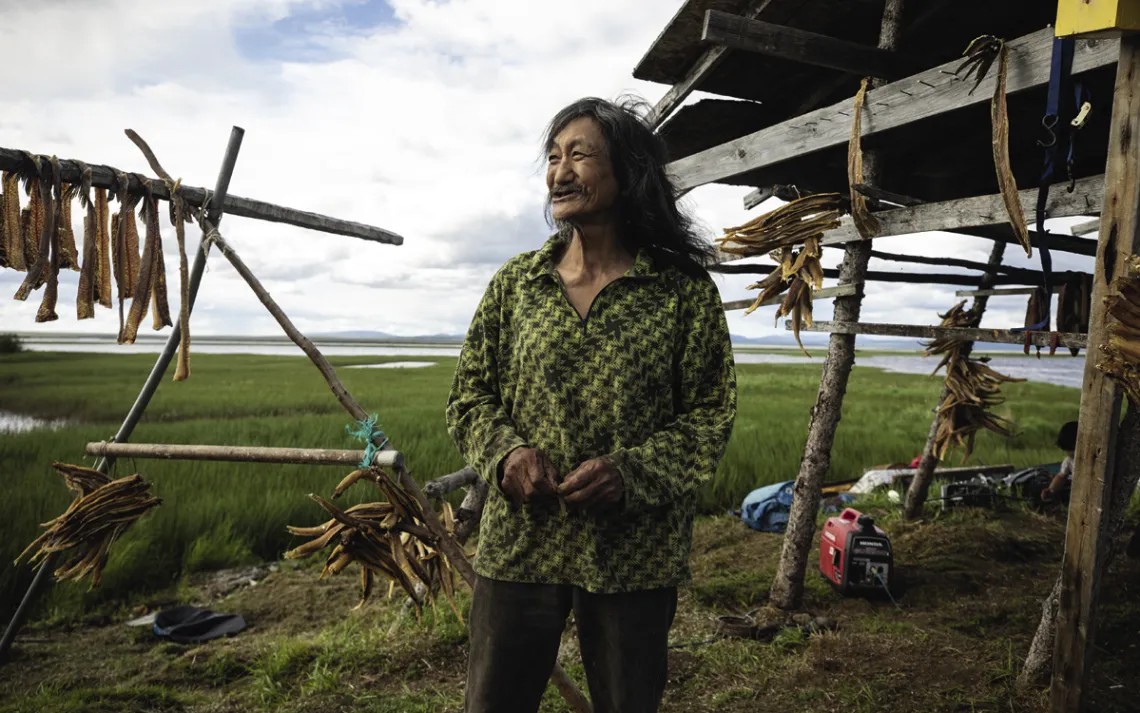 Ingram Clark at his family's fish camp on the river; he says that the shoreline is eroding by about two feet per year.