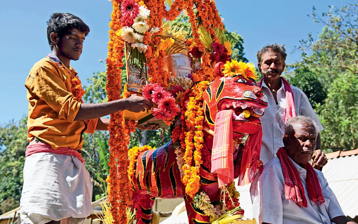Soliga tribesmen preparing a new statue of the tiger god Huli Veerappa