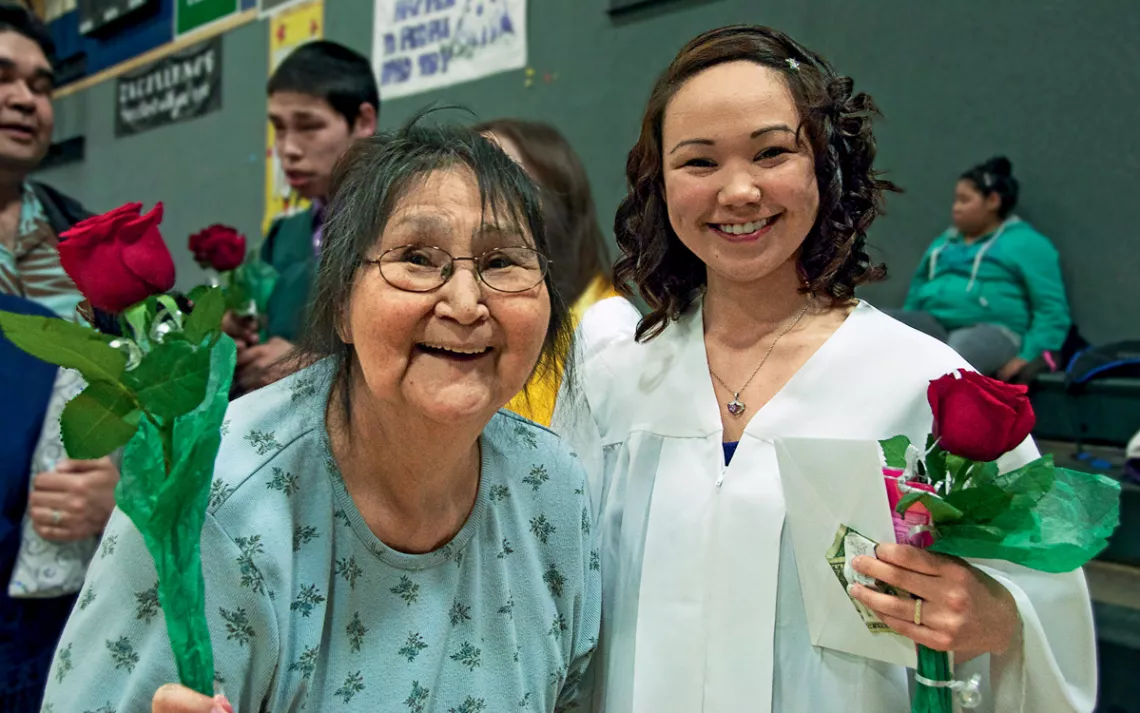 Tammy Iyatunguk and her grandmother Nora Kuzuguk at Tammy's high school graduation in Shishmaref. 