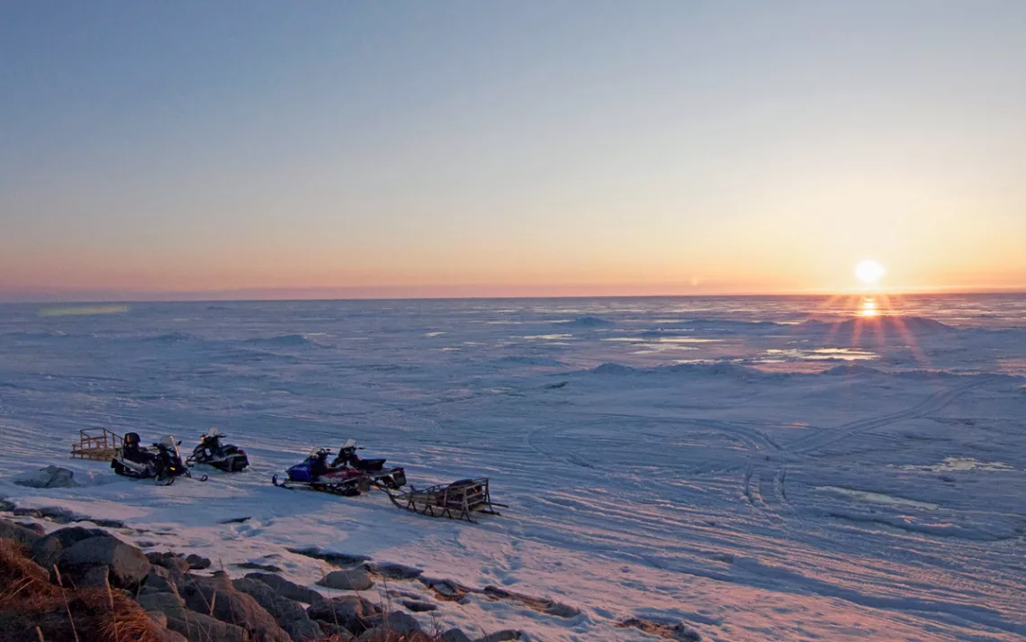 Snowmobiles have replaced dogsleds as the main mode of transport in this Alaskan Arctic village.