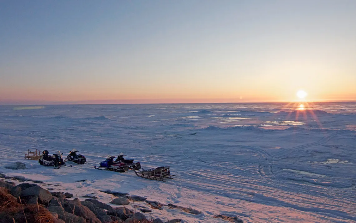 Snowmobiles have replaced dogsleds as the main mode of transport in this Alaskan Arctic village.