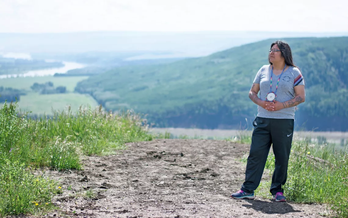 Connie Greyeyes in front of Peace River