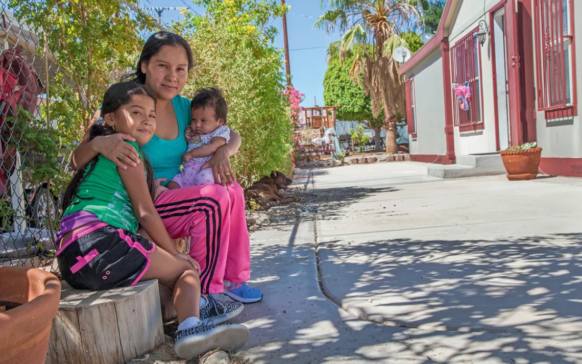 Maria Pozar with her children, Jacqueline and Leslie