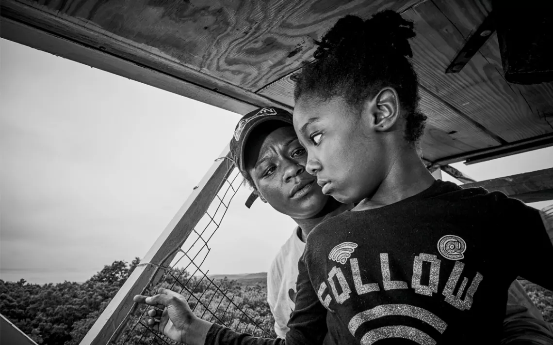 Moet and Harlem atop a fire tower