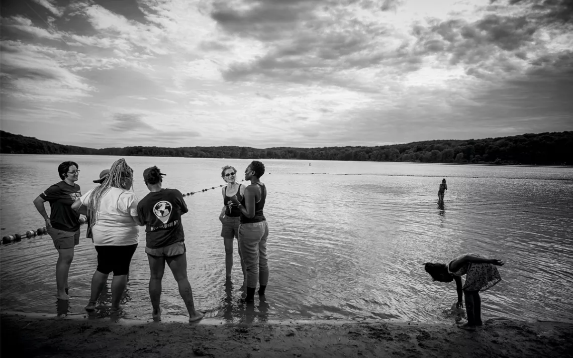 On a beach overlooking a lake in Harriman State Park, the children play while their moms do what they came here to do: connect.