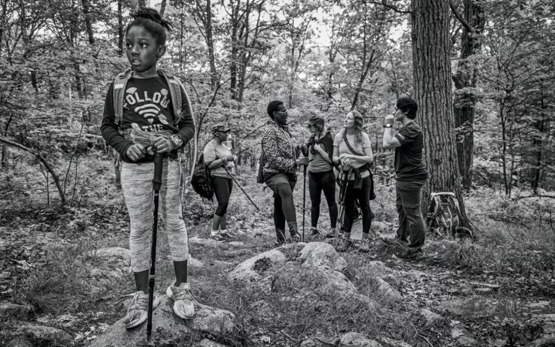 Harlem, daughter of navy veteran Moet Valdez, takes the lead during a hike in New York's Harriman State Park. 