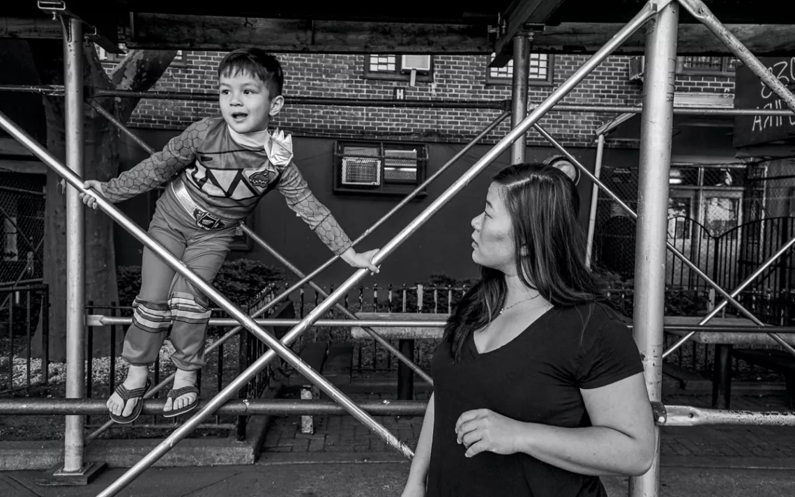 Sherry Swartwout with her son, Elijah, outside their home in Inwood, New York