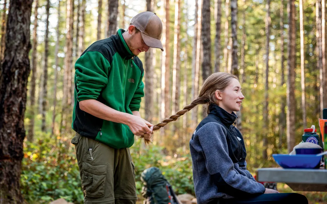 Elliot Drake-Maurer braids Courtney Carnevale's hair