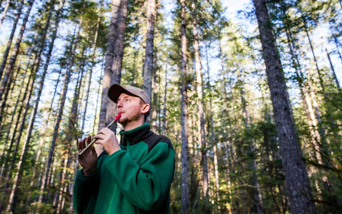 Outdoor educator Elliot Drake-Maurer plays the penny whistle at the beginning of the trip.