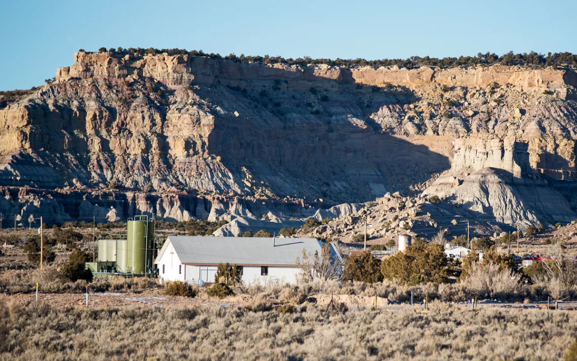 Residential homes surround gas and oil operations equipment near Counselor, New Mexico.