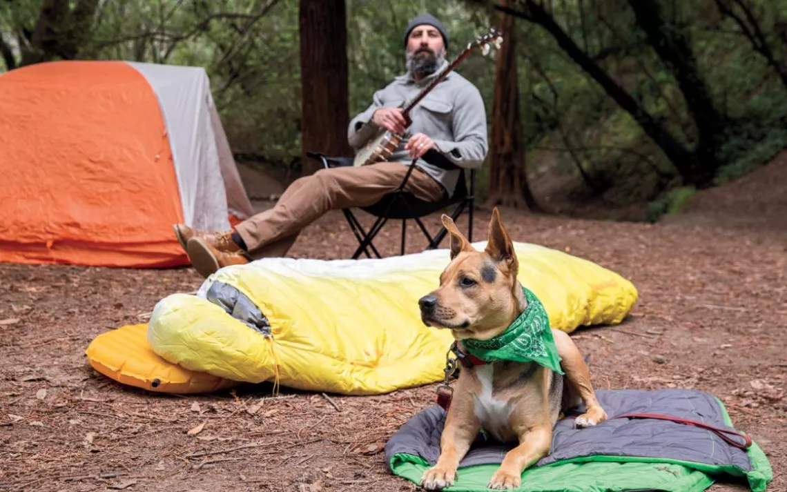 Man camping with. dog