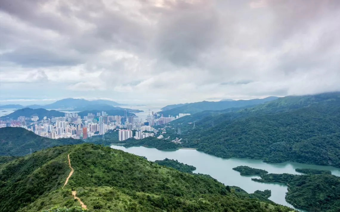 High-rises, power lines, and cell towers punctuate the view along the MacLehose Trail.