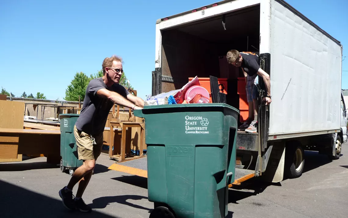 OSU staff move materials during the Move Out Donation Drive, which in 2018 collected over 32,300 pounds of reusable material.