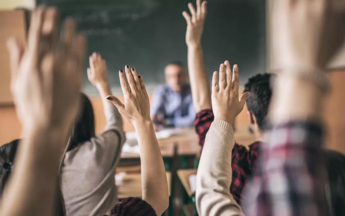 hands raised in class