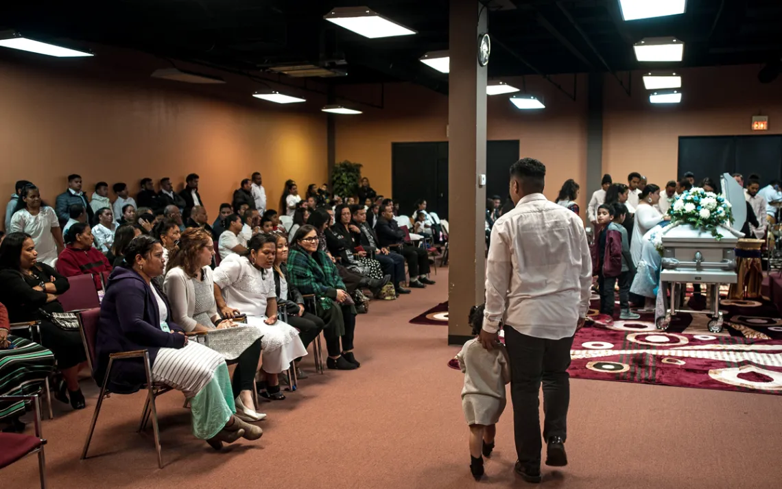 The Marshallese community gathers for a funeral in Springdale.