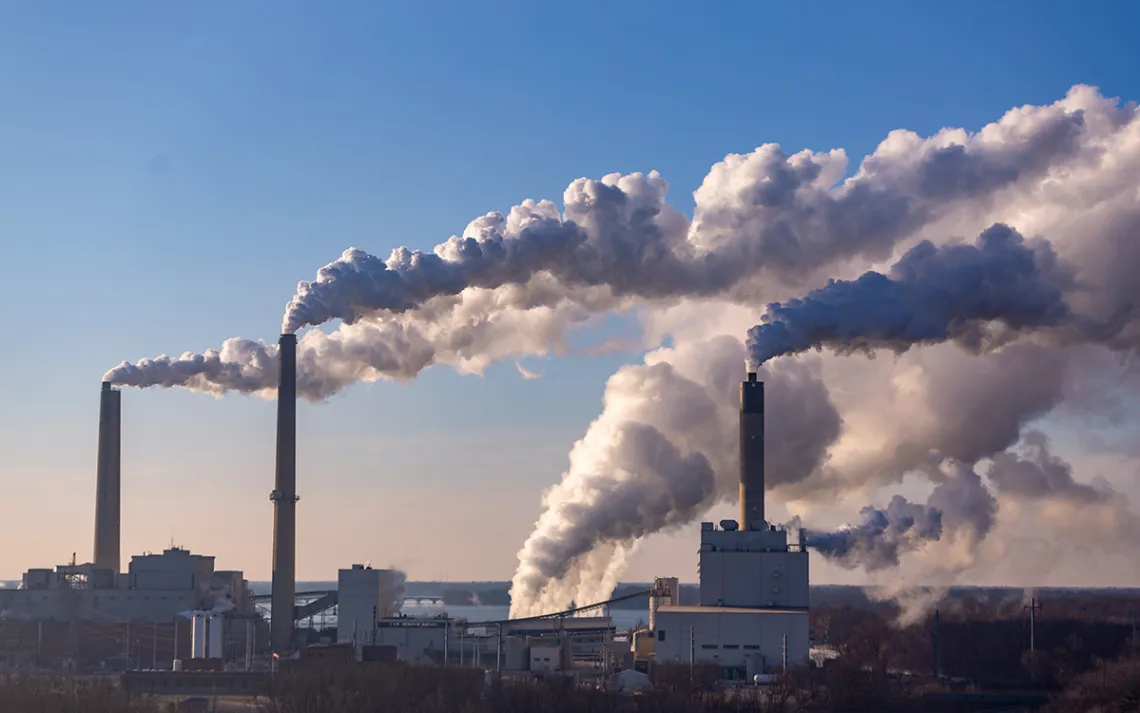 Wind is blowing pollution from a coal burning power plant.