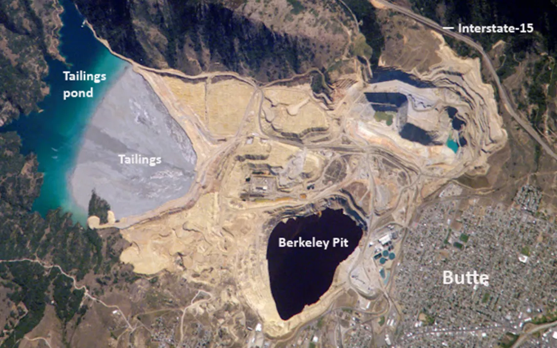 A satellite view of the toxic Berkeley Pit, a former open pit copper mine that is currently one of the largest Superfund sites.
