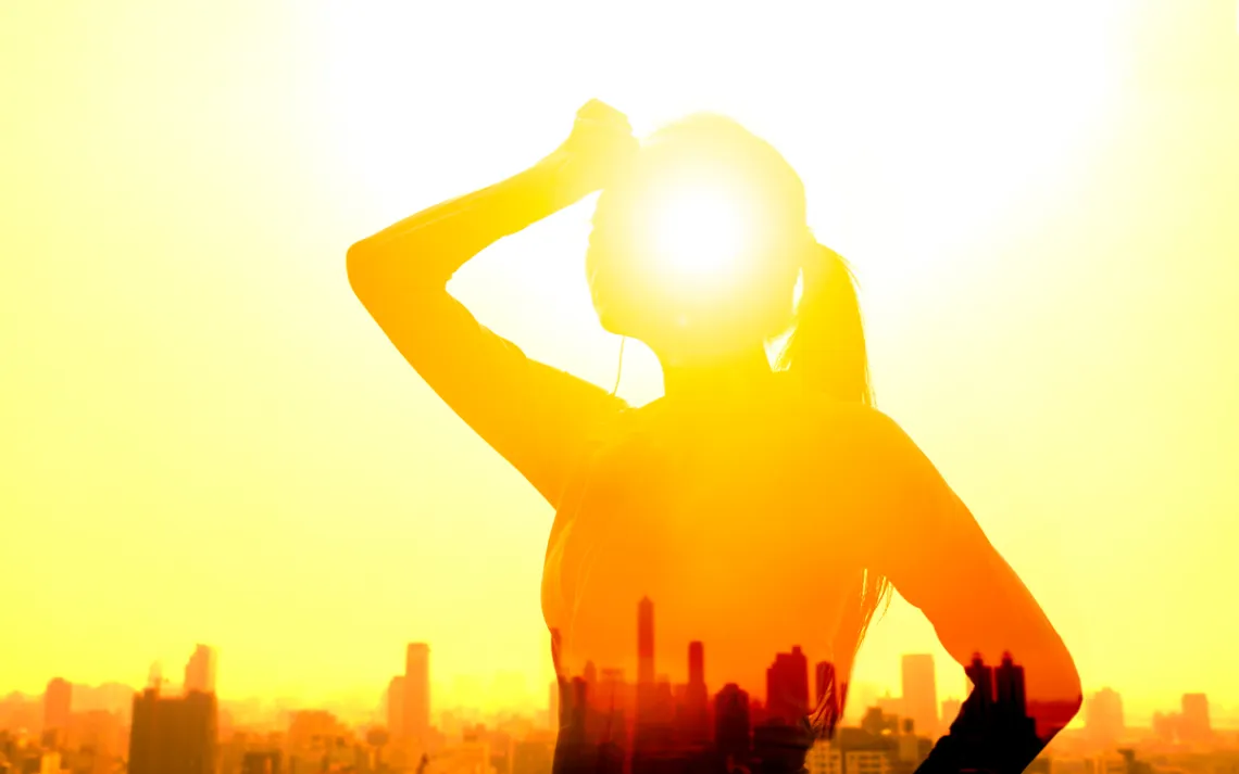 Double exposure portrait of young fitness Woman hand wiping sweat and summer heat wave concept. 
