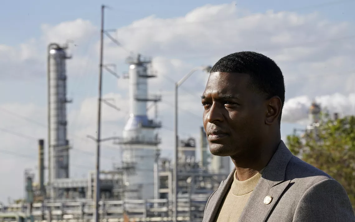 man with power plant in the background