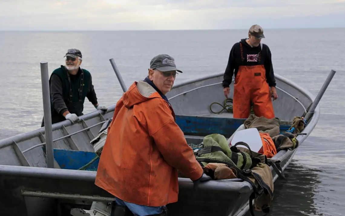 On a productive day, Terry Jorgensen, Ward Grant, and Rick Volk (from left) can catch over 1,000 salmon.