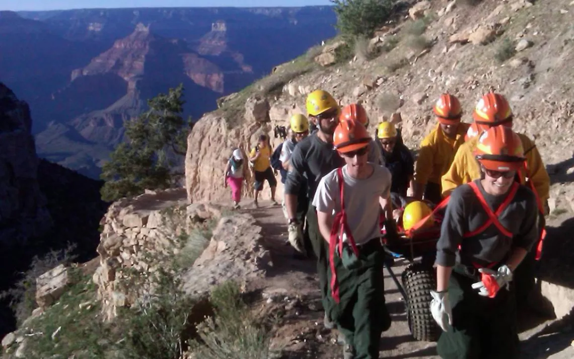 Rescuers at Grand Canyon National Park conduct a litter carryout of an injured patient on the Bright Angel Trail. 