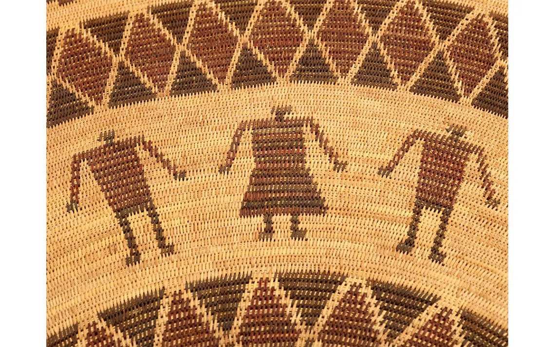 A gambling tray, woven of deergrass, sedge root, redbud, and bracken fern, took Bohna almost a year to complete