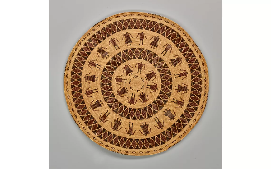 A gambling tray, woven of deergrass, sedge root, redbud, and bracken fern, took Bohna almost a year to complete