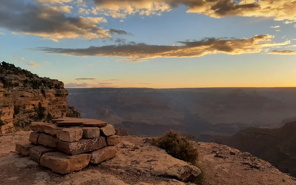 A deep canyon displaying towers and spires outlined by white sandstone.
