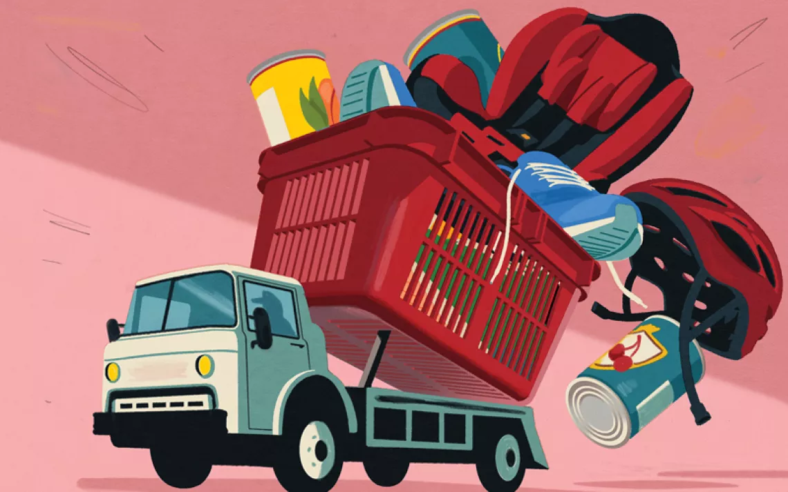 Colorful illustration shows a dump truck with a red food basket as its bed. Inside are helmets, cans of food, shoes, and a car seat falling out.