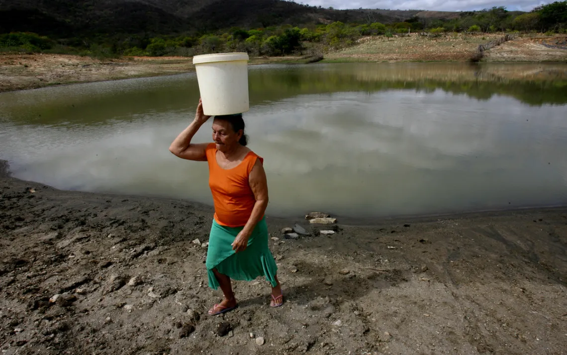 woman carrying water