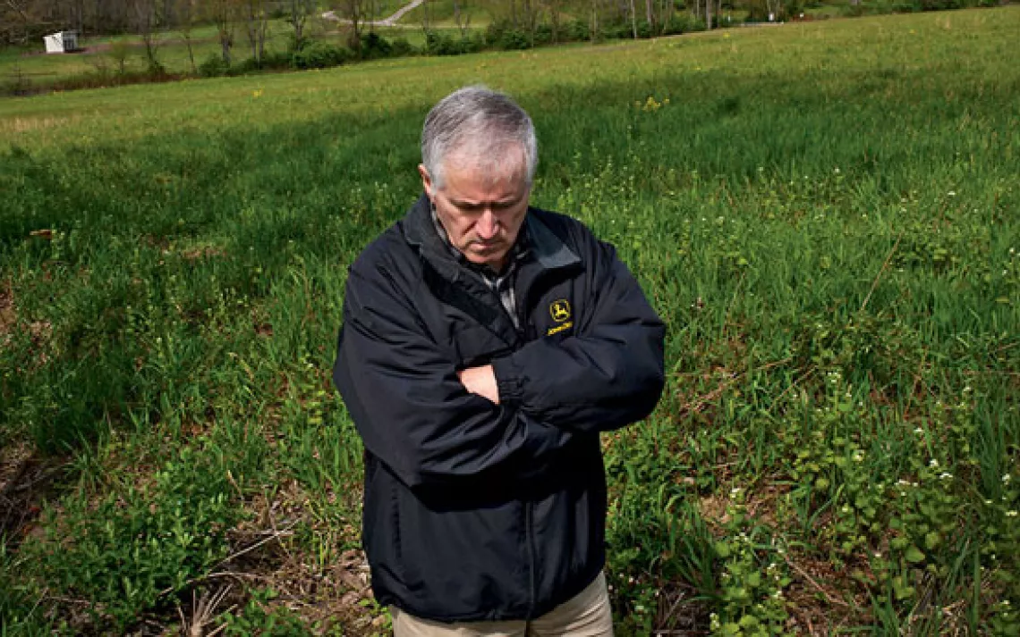 Farmer turned activist Ron Gulla in front of the farm he lost to fracking.